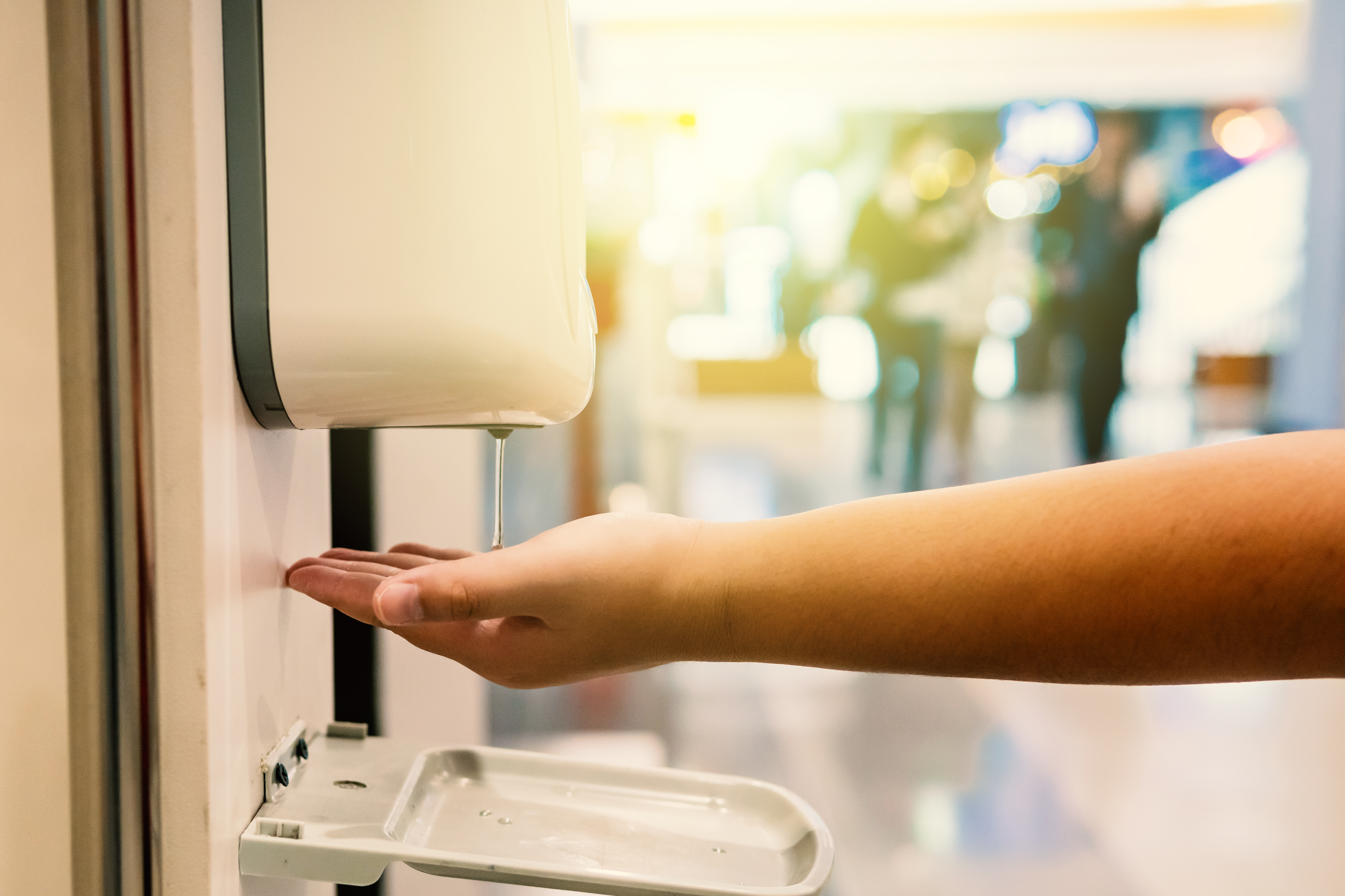 Foot operated sanitizer dispensers and sanitizer 
